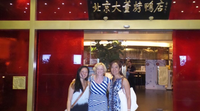 Being taken to a tasty duck restaurant in Beijing